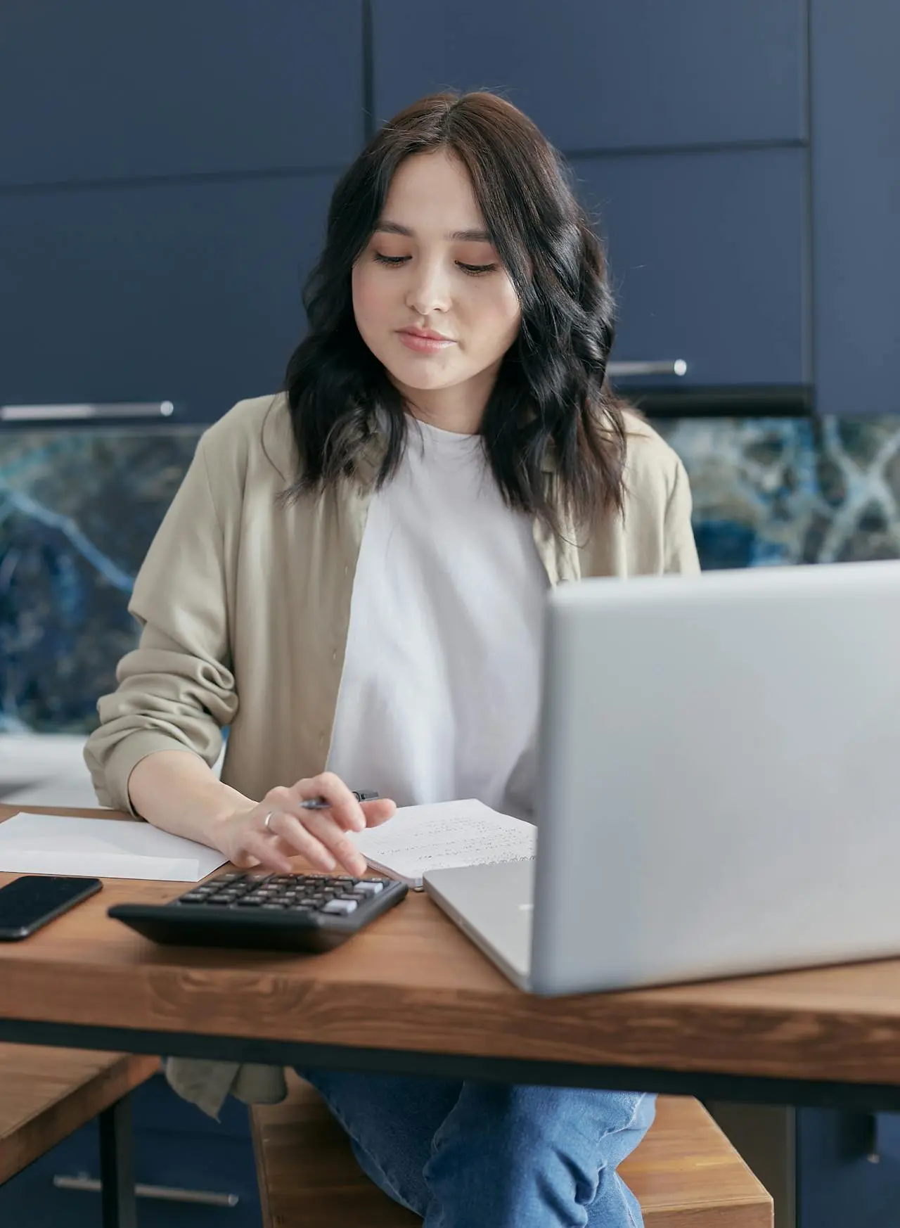 Business owner working with accounting software on a laptop
