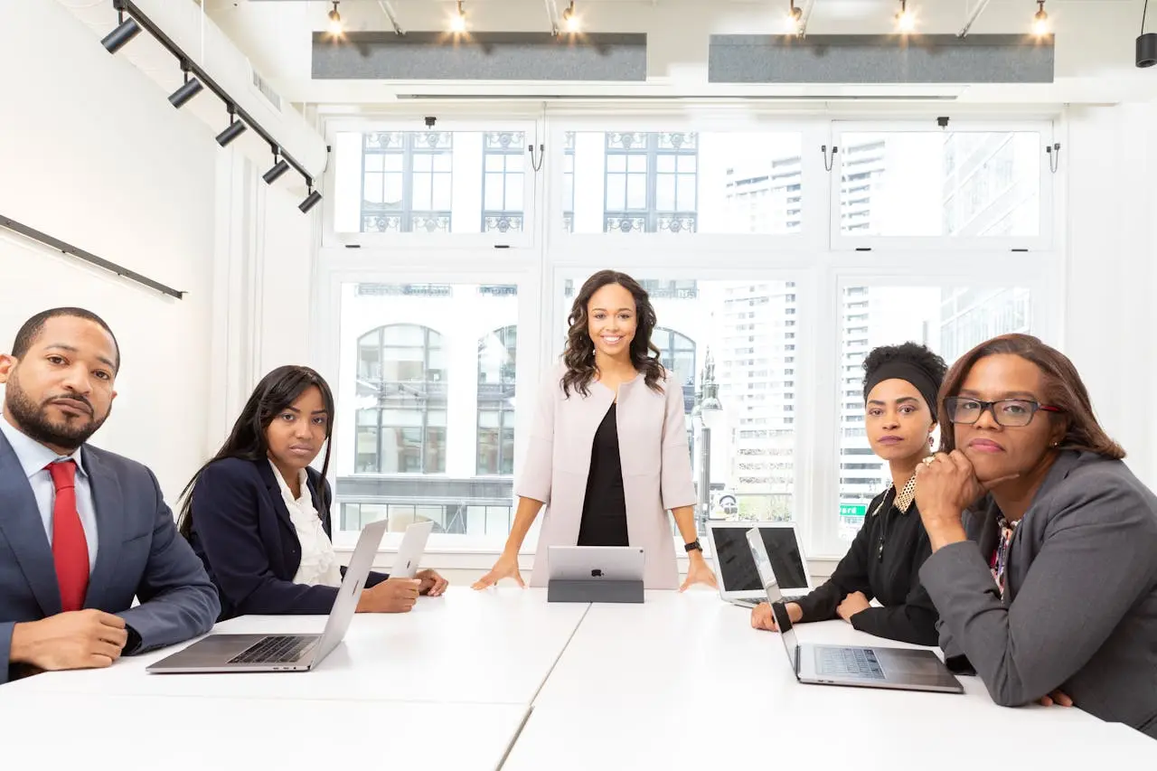 Business team reviewing financial information around a boardroom table