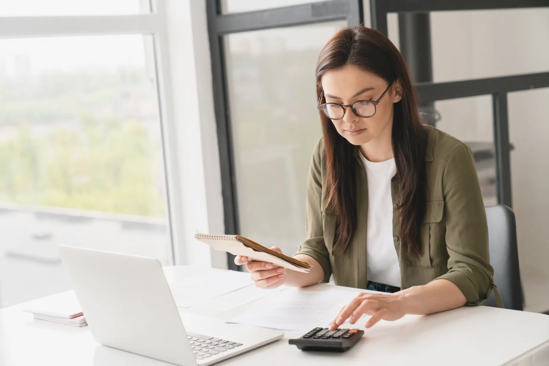 Business professional reviewing invoices and payment records